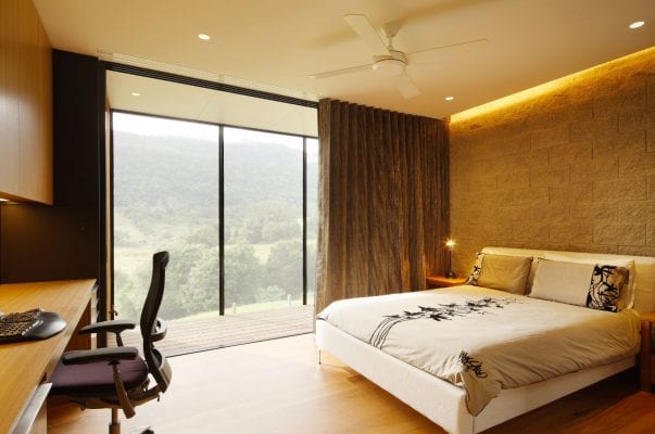 A bedroom with a view of the mountains.