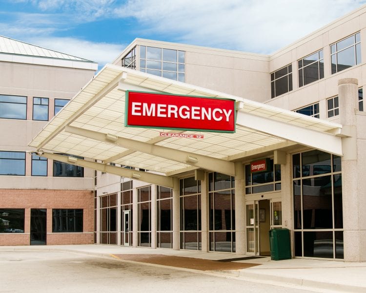 A hospital emergency room with the word " emergency " on it.