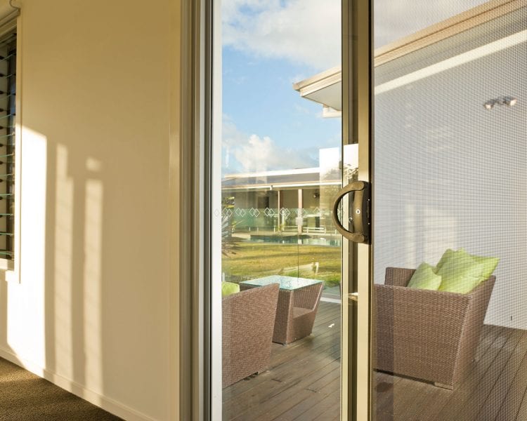 A sliding glass door with a view of the outside.